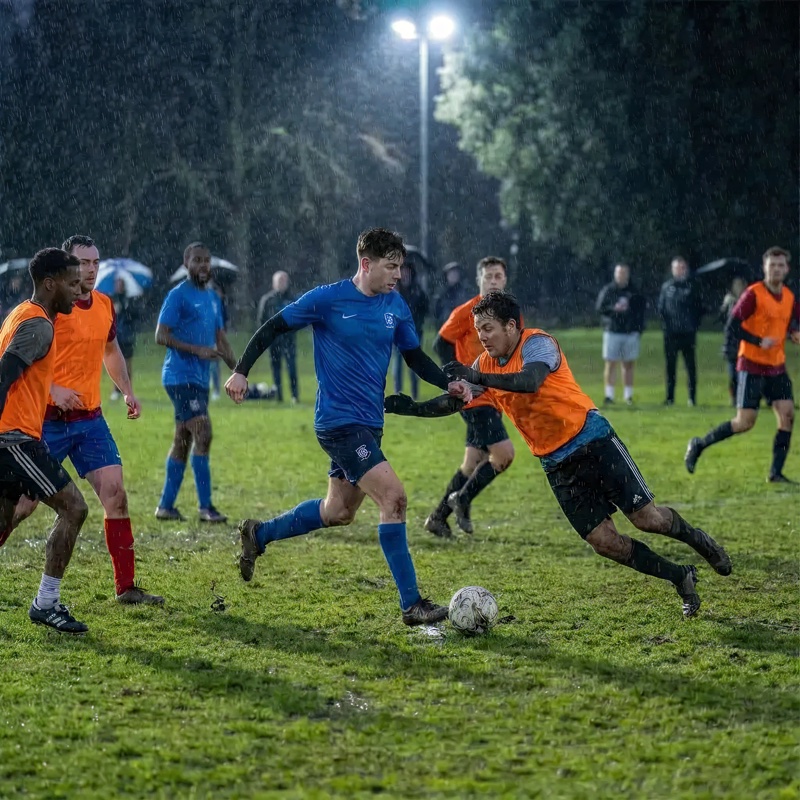 Group of people playing football at night