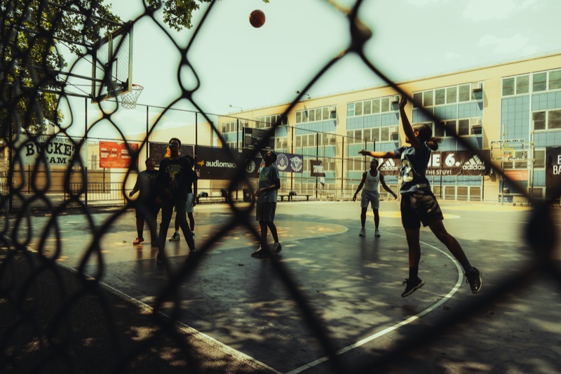 Basketball game through fence